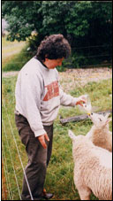 Gretchen feeding lambs